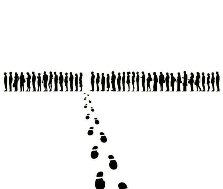 Red figure standing out in a white crowd